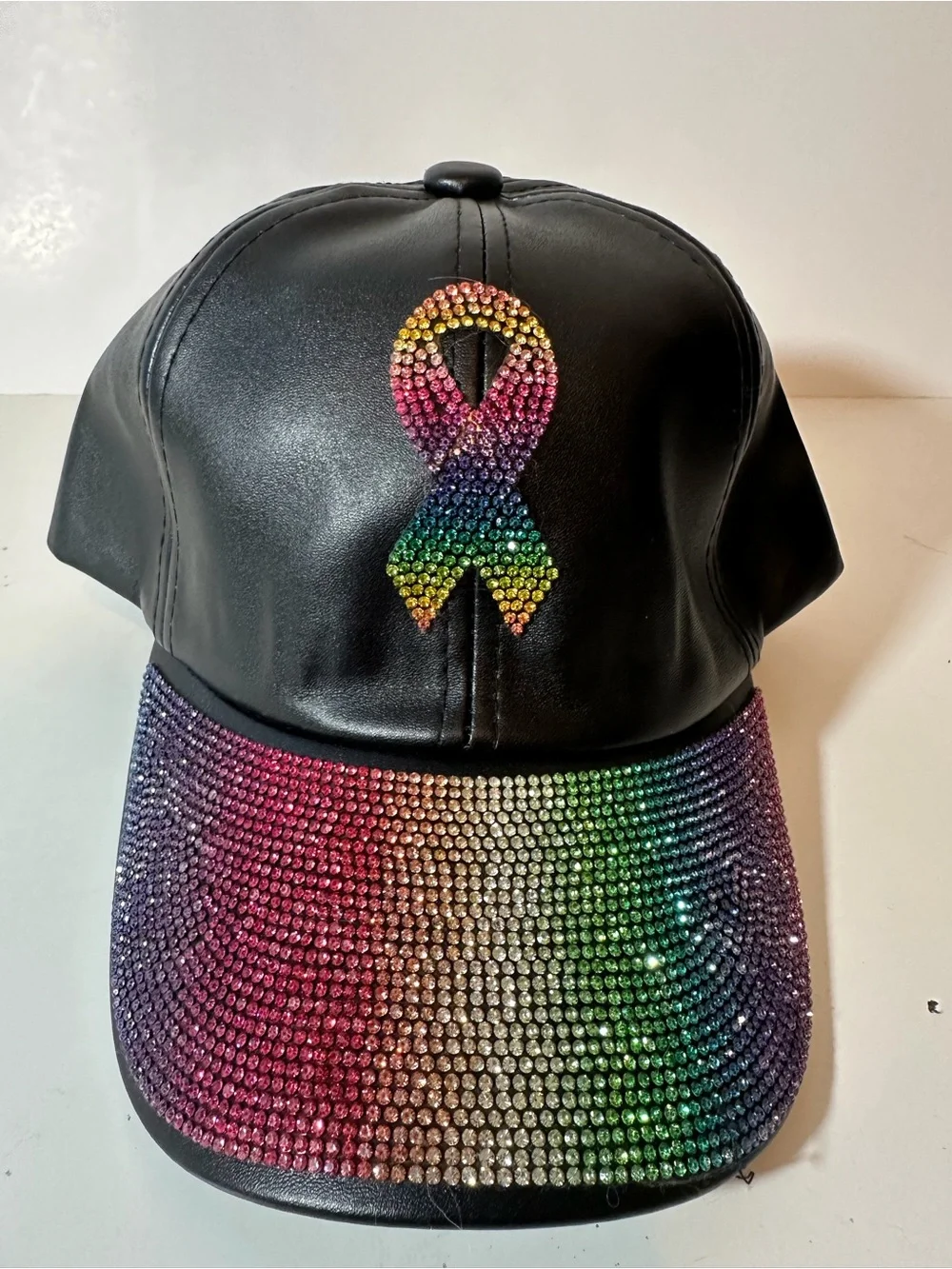 VERA New York Rainbow Rhinestone Awareness Ribbon Faux Leather Hat Black